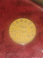 Reverse of 1933 Canadian coin showing date and maple leaves