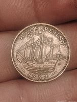 Reverse with Golden Hind ship and date