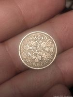 Reverse side showing floral emblem design, value and date