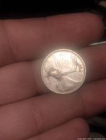 Reverse showing caribou and date