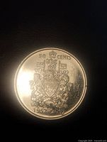 Reverse with Canadian coat of arms and dates 1952-2002