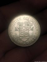 Reverse showing BRITISH COLUMBIA CANADA DOLLAR legend, provincial shield, floral design, dated 1871-1971