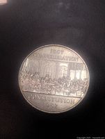Reverse of the 1982 Canada Constitution dollar showing 1867 Confederation Constitution 1982 design