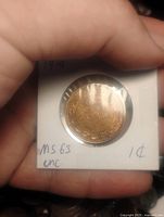 Reverse of 1919 Canada one cent coin showing date and denomination in holder