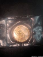 Reverse side of sealed 2010 Royal Canadian Navy Centennial $1 coin