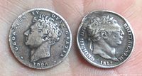 Obverse sides of both shilling coins showing George IV (1826) and George III (1817) portraits