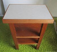 Overall view of side table showing shelves and laminate top