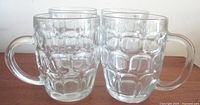 Set of four clear thumbprint pattern beer mugs