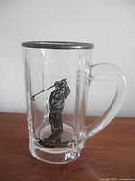 Front view showing golfer overlay and panelled glass body