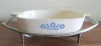 Casserole seated in chrome stand, showing Cornflower motif