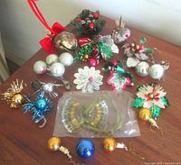 Overview of assorted vintage Christmas decorations on table
