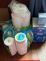 Group shot of all paper goods showing paper towels, tissues, toilet paper