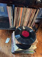 Shelf section with standing LP jackets and stacked loose records