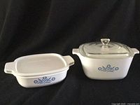 Both casserole dishes side by side, showing pattern and lids