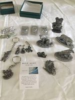 overall view showing money clips, hair clips, key chains, figurines and ornament