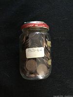 Full view of jar with label showing date range 1953-64