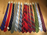 Full set of 13 wool ties laid out to show patterns and colors