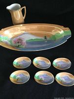 Full view of tray, six dishes, and creamer