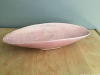 Top view of pink speckled ceramic oval bowl