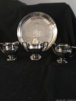 Group shot of tray, creamer and two sugar bowls