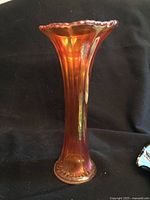 Full view of amber iridescent pressed glass vase