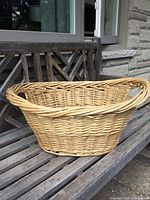 Side view showing full oval basket on bench