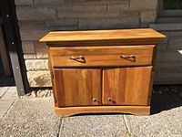 Front view of pine sideboard showing drawer, doors, hardware, and overall finish