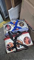 Two bags filled with Harlequin romance paperbacks