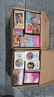Open box showing two layers of Harlequin romance paperbacks