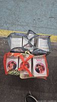 Two tote bags filled with paperback Harlequin Romance books
