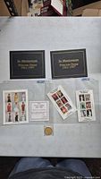 Overview of two booklets, three stamp sheets, coin, COA