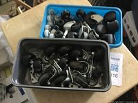 Two tubs filled with assorted casters