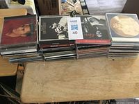 Entire collection of Elvis CDs stacked on table