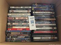 Box containing approximately 45 DVD cases