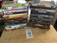 Two stacks of DVD cases on table