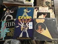 Front covers of six Elvis LPs laid out on table
