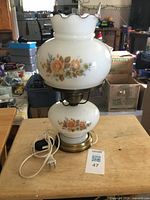 Full view of assembled double-globe lamp on table