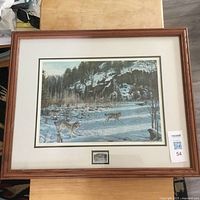 Full view of framed signed print with mat and stamp