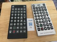 Front view of two jumbo remotes showing button layouts and size