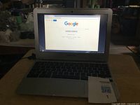 Front view of Samsung Chromebook powered on displaying Google homepage