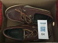 Top view of both shoes in box showing overall condition