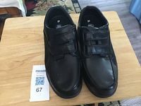 Top view of both shoes showing size labels and overall condition