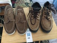 Both pairs of shoes together on table