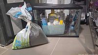 Full view of tank with supplies and substrate bag