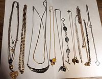 All twelve necklaces laid out for full view