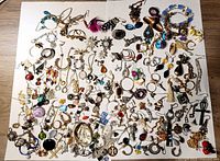 Full layout of all earrings on two white boards