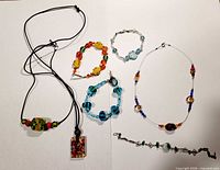 All seven jewellery pieces laid out