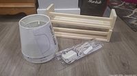 Two SKOTTORP lamp shades, LEDBERG light strip package, BEKVÄM spice racks displayed on floor