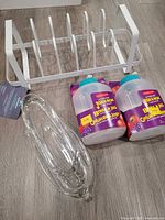 Overall view of lid organizer, two juice boxes, glass tray