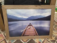 Front view of framed canoe photograph